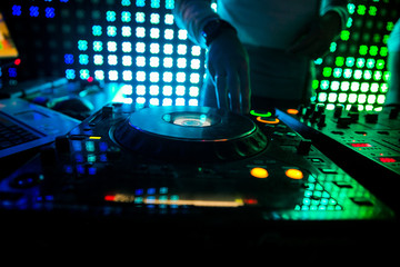 Deejay at the Party.hand of the DJ operator.DJ playing music at mixer closeup