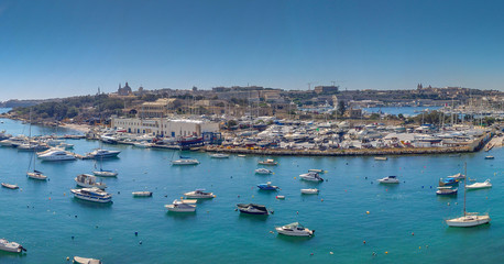 Fototapeta na wymiar Boats in Marsamxett Harbour in front of Manoel Island, Malta.
