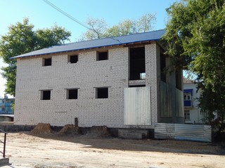 Construction of a brick house. Two-storey country cottage. New real estate.