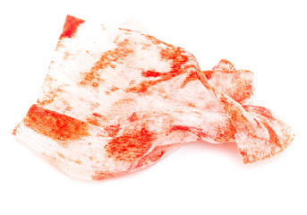 Napkin in red blood on white background