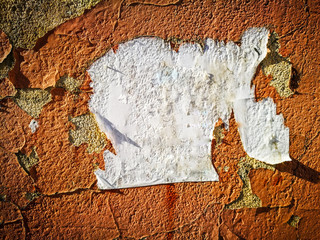 Traces of paper on the wall from ads