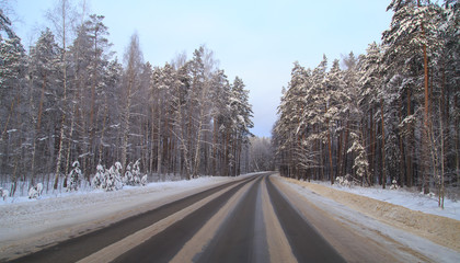 Obraz premium Snow road in the forest in winter