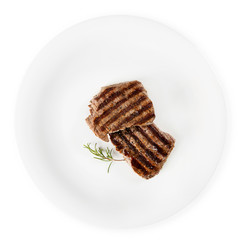 Two steaks and rosemary on a white background.