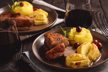 Roasted duck breast with apples and cranberries.