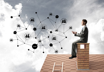 Businessman or student on brick roof and concept of social connection