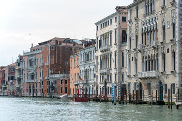 Gondola passing by multicolored buildings