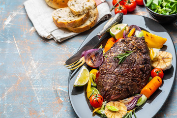 Club Beef steak with pepper sauce and Grilled vegetables on dark wooden background. Roas beef. Copy space.