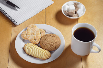 Cookies, coffee and notebook