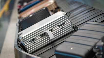 Passengers' Luggage On Conveyor Belt In Airport