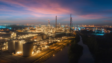 Oil refinery factory with beautiful sky at dusk for energy or gas industry or transportation background. - 232981379