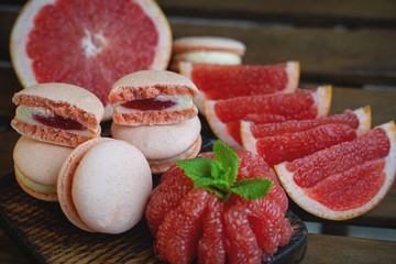 Peanut and chocolate cookies on wooden background in sun rays