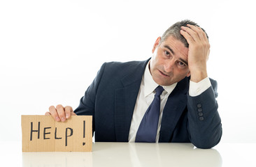 Mature businessman worried and desperate asking for help