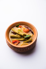 Drumstick Curry or Shevga sheng bhaji or south indian Sambar, served in a bowl over moody background. Selective focus