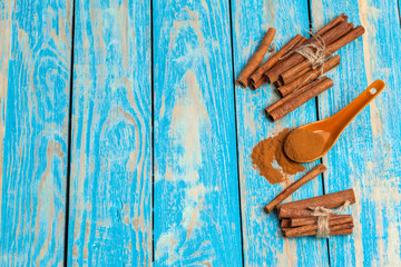 Cinnamon on wooden board.