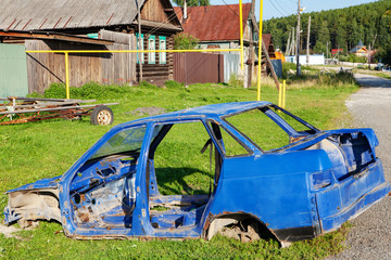 The old body of the car Lada, blue. scrap car.