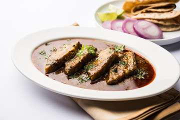 Patodi Rassa Bhaji or patwadi Sabji, a popular Maharashtrian spicy recipe served with Chapati and salad. Selective focus