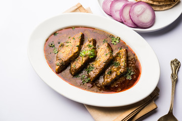 Patodi Rassa Bhaji or patwadi Sabji, a popular Maharashtrian spicy recipe served with Chapati and salad. Selective focus