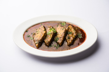 Patodi Rassa Bhaji or patwadi Sabji, a popular Maharashtrian spicy recipe served with Chapati and salad. Selective focus