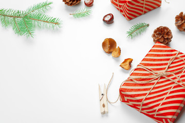 Christmas gift boxes decorated with cone on white background