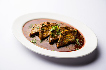 Patodi Rassa Bhaji or patwadi Sabji, a popular Maharashtrian spicy recipe served with Chapati and salad. Selective focus