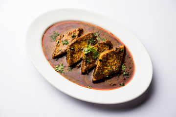 Patodi Rassa Bhaji or patwadi Sabji, a popular Maharashtrian spicy recipe served with Chapati and salad. Selective focus