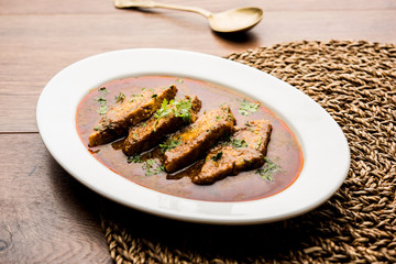 Patodi Rassa Bhaji or patwadi Sabji, a popular Maharashtrian spicy recipe served with Chapati and salad. Selective focus
