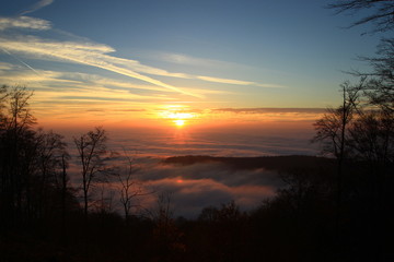 Fototapeta na wymiar Sunset over foggy land