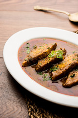 Patodi Rassa Bhaji or patwadi Sabji, a popular Maharashtrian spicy recipe served with Chapati and salad. Selective focus