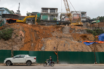 crane on hill in a city