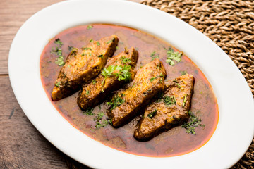 Patodi Rassa Bhaji or patwadi Sabji, a popular Maharashtrian spicy recipe served with Chapati and salad. Selective focus