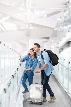 Asian couple traveler with luggage at airport