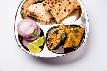 Patodi Rassa Bhaji or patwadi Sabji, a popular Maharashtrian spicy recipe served with Chapati and salad. Selective focus
