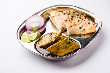 Patodi Rassa Bhaji or patwadi Sabji, a popular Maharashtrian spicy recipe served with Chapati and salad. Selective focus