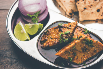 Patodi Rassa Bhaji or patwadi Sabji, a popular Maharashtrian spicy recipe served with Chapati and salad. Selective focus