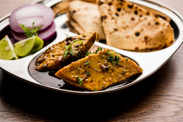 Patodi Rassa Bhaji or patwadi Sabji, a popular Maharashtrian spicy recipe served with Chapati and salad. Selective focus