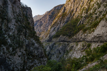 Fototapeta na wymiar Gorge of the mountain with a deep canyon.Dangerous road.