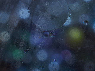 Abstract photography. Multi-colored circles. Drop of oil.