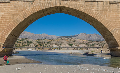 Mount Nemrut, Turkey - part of the Unesco World Heritage site of Mount Nemrut, the Severan Bridge is a example of roman architecture. Here in particular a look at the bridge and background landscape