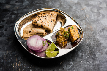 Patodi Rassa Bhaji or patwadi Sabji, a popular Maharashtrian spicy recipe served with Chapati and salad. Selective focus