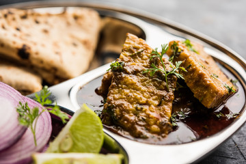 Patodi Rassa Bhaji or patwadi Sabji, a popular Maharashtrian spicy recipe served with Chapati and salad. Selective focus