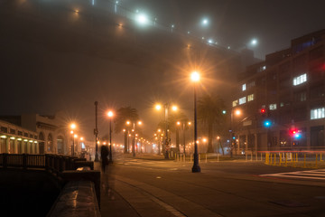 traffic in the city at a foggy night