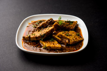 Patodi Rassa Bhaji or patwadi Sabji, a popular Maharashtrian spicy recipe served with Chapati and salad. Selective focus