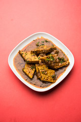 Patodi Rassa Bhaji or patwadi Sabji, a popular Maharashtrian spicy recipe served with Chapati and salad. Selective focus