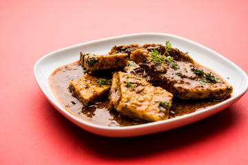 Patodi Rassa Bhaji or patwadi Sabji, a popular Maharashtrian spicy recipe served with Chapati and salad. Selective focus