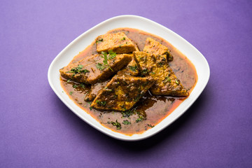 Patodi Rassa Bhaji or patwadi Sabji, a popular Maharashtrian spicy recipe served with Chapati and salad. Selective focus