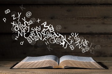 Open bible on desk.