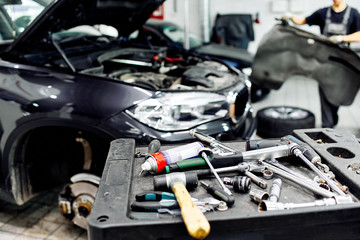Tools for car service, car service room. Mechanic tools for maintenance car in garage