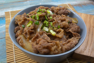 Cooked beef with rice on bowl