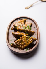 Patodi Rassa Bhaji or patwadi Sabji, a popular Maharashtrian spicy recipe served with Chapati and salad. Selective focus