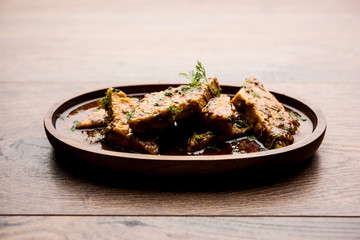 Patodi Rassa Bhaji or patwadi Sabji, a popular Maharashtrian spicy recipe served with Chapati and salad. Selective focus